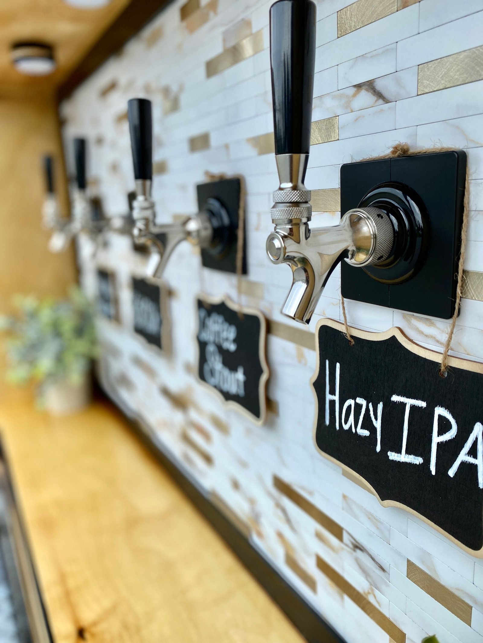 Close up of the Tonic and Timber tap wall with glassware lined up